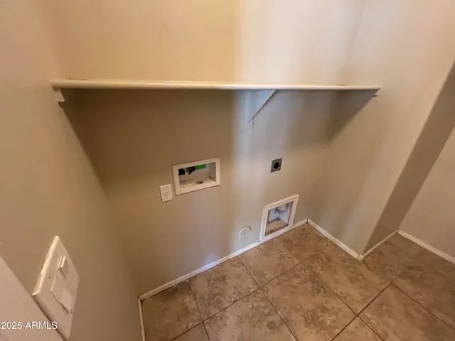 a view of a refrigerator in kitchen and hallway