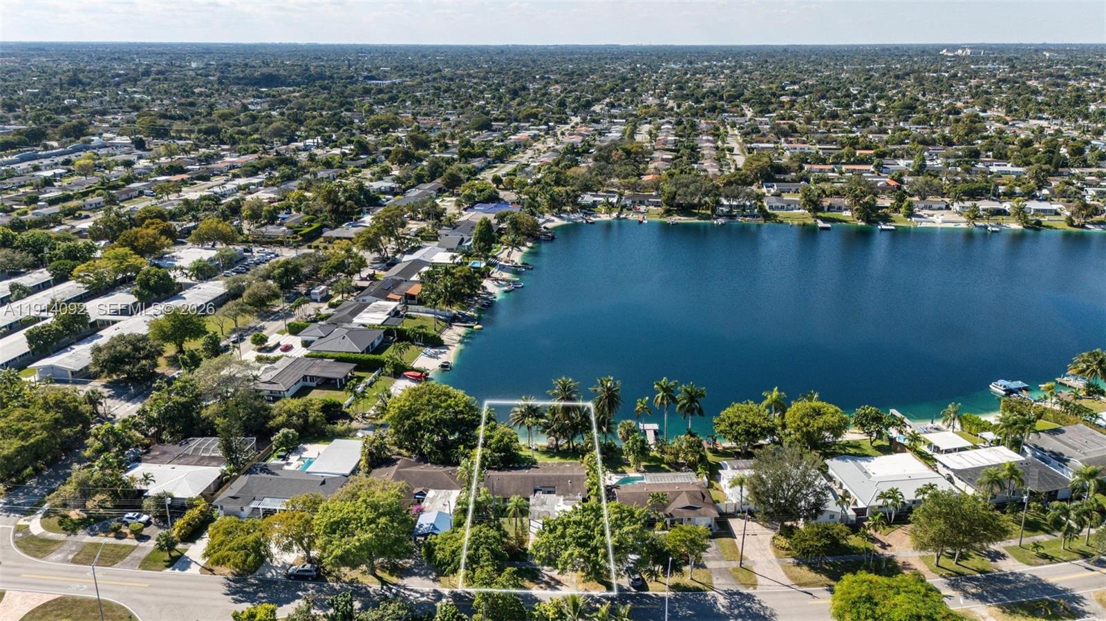 5110 Southwest 92nd Avenue Miami, FL 33165 - Photo 4 of 20 an aerial view of a house with a yard and lake view