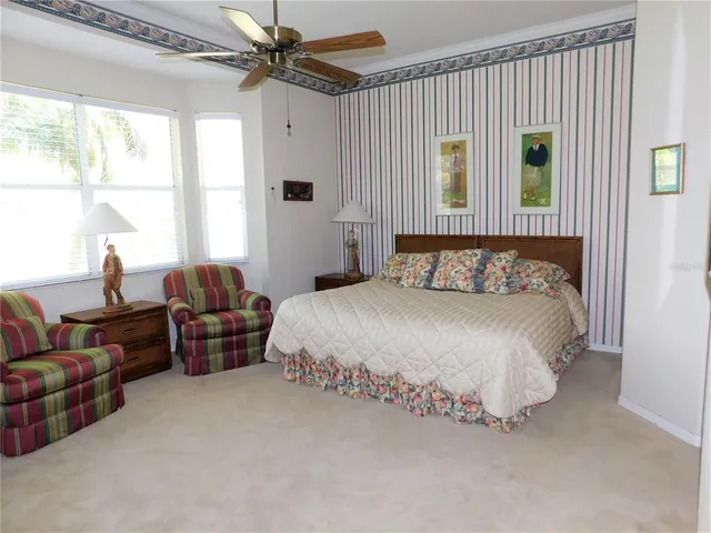a bedroom with bed and window