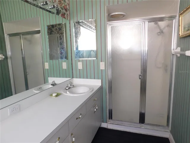 a bathroom with a sink and mirror