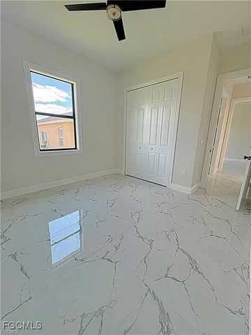 a view of a livingroom with an empty space and a window