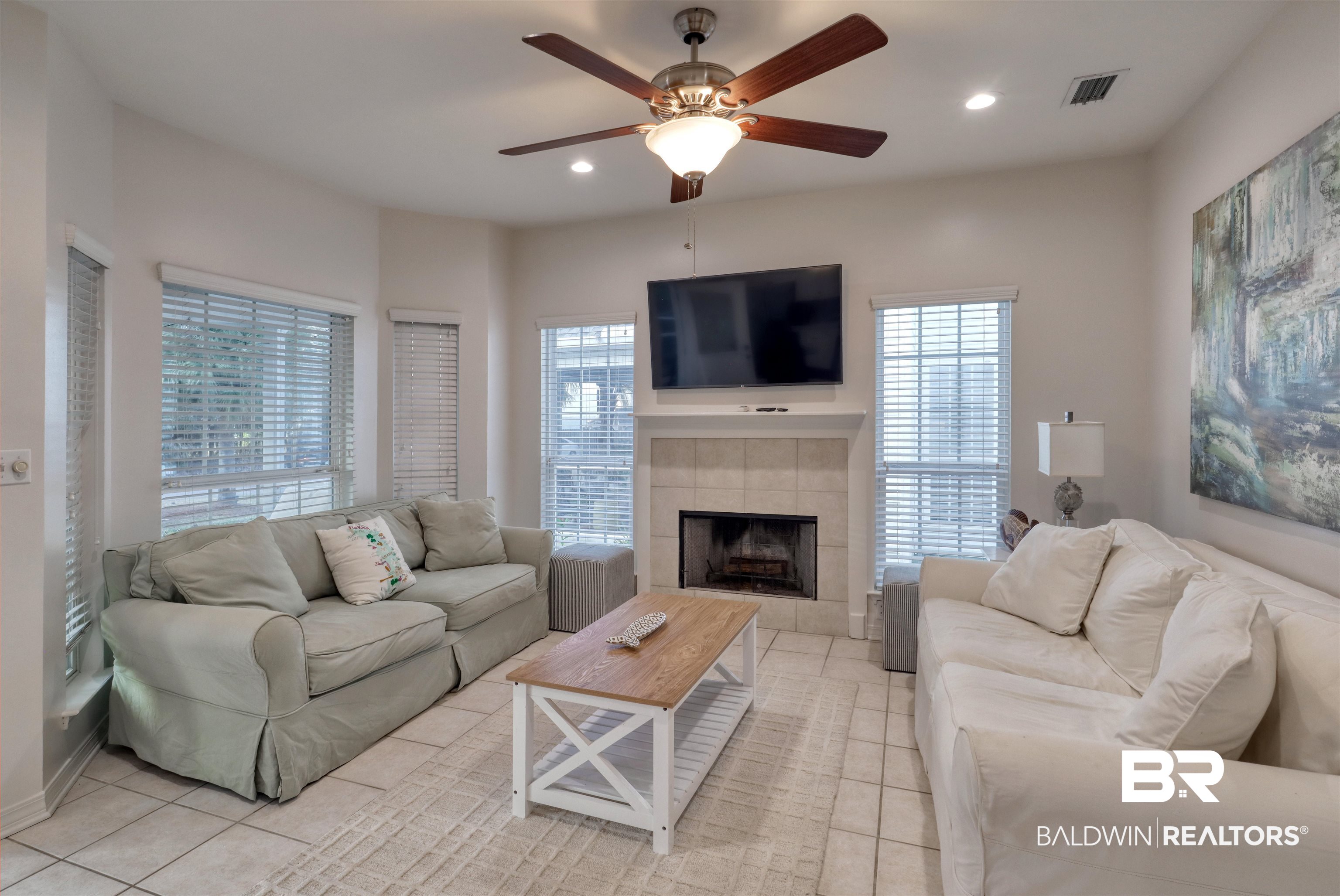26063 Canal Road, Unit C2 Orange Beach, AL 36561 - Photo 5 of 30 Living area with a fireplace, light tile patterned floors, ceiling fan, healthy amount of natural light, and recessed lighting