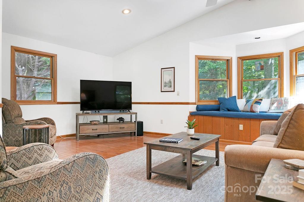 58 Warwaseeta Court Brevard, NC 28712 - Photo 13 of 48 a living room with furniture and a flat screen tv
