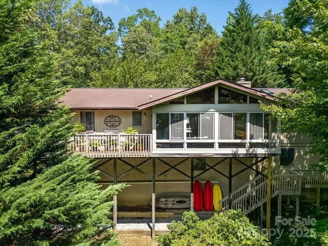 a front view of a house with sitting area