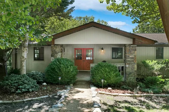 front view of a house with potted plants
