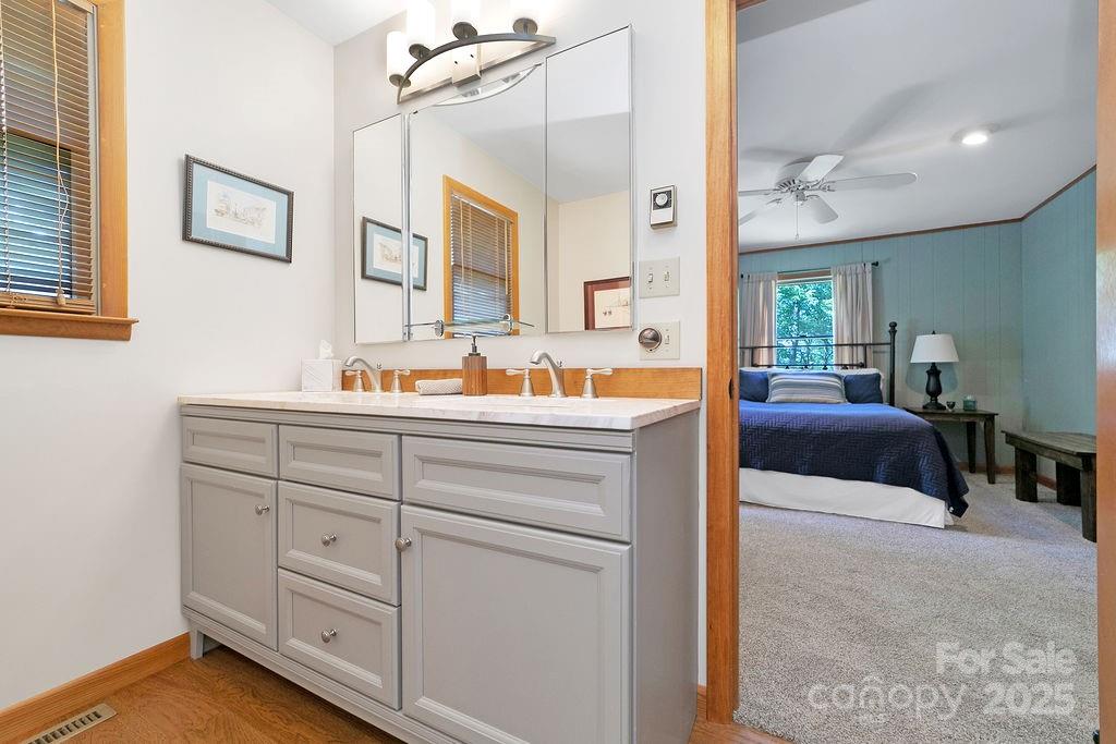 58 Warwaseeta Court Brevard, NC 28712 - Photo 33 of 48 a en suite bathroom with double vanity and a mirror