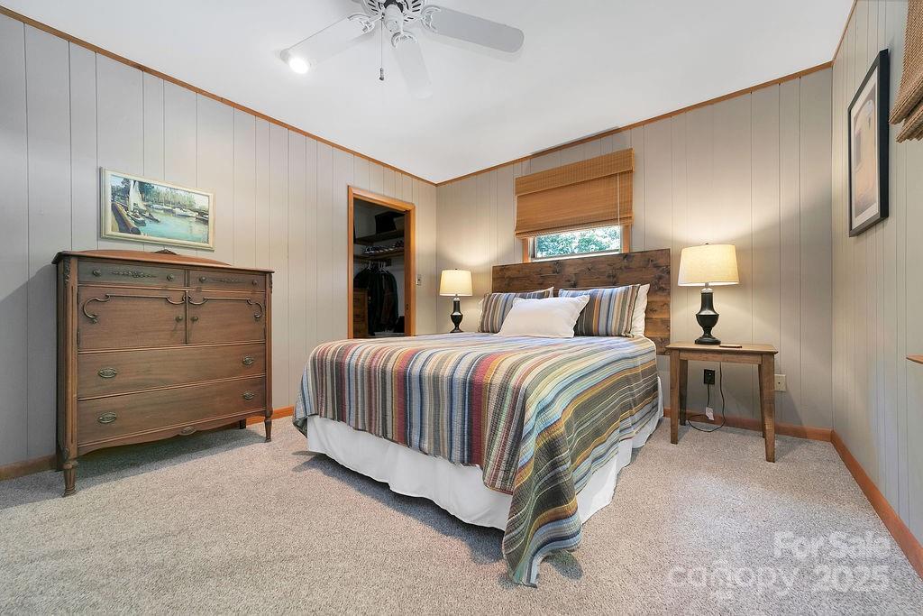 58 Warwaseeta Court Brevard, NC 28712 - Photo 36 of 48 a bedroom with a bed and a night stand