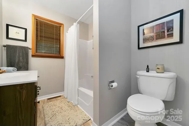 a bathroom with a sink a vanity and a window