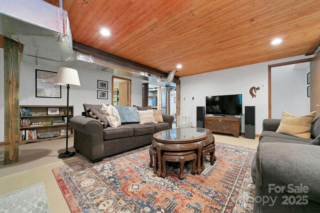 58 Warwaseeta Court Brevard, NC 28712 - Photo 40 of 48 a living room with furniture and a flat screen tv