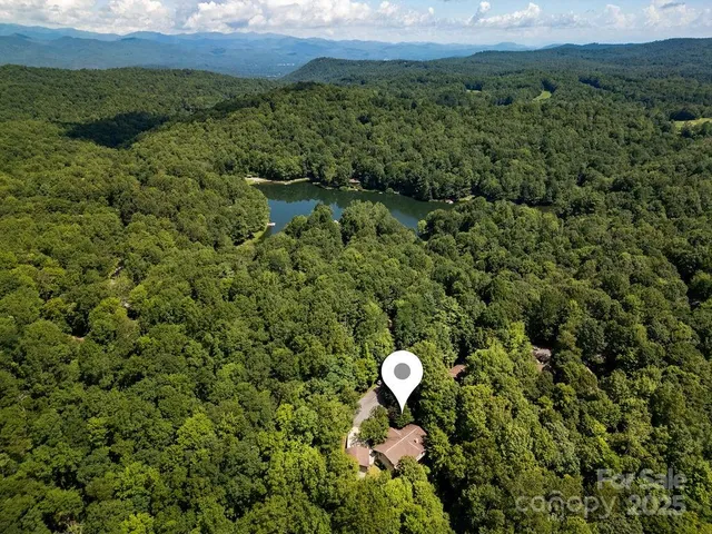 a view of a back yard and swimming pool