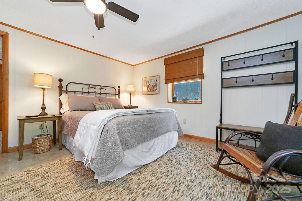 58 Warwaseeta Court Brevard, NC 28712 - Photo 43 of 48 a bedroom with a bed and wooden floor