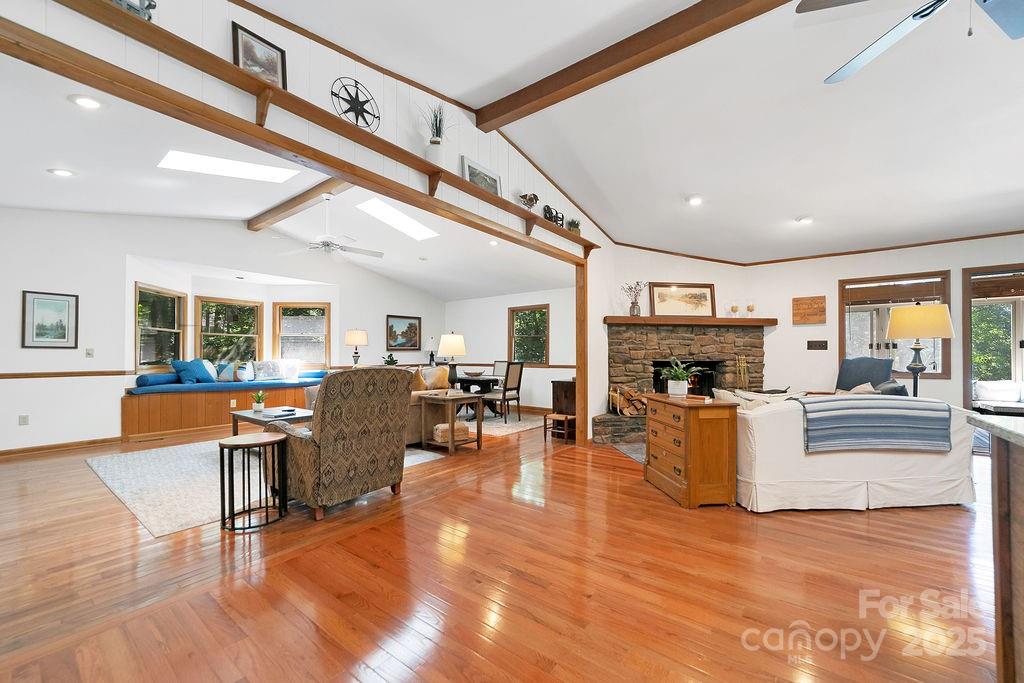 58 Warwaseeta Court Brevard, NC 28712 - Photo 9 of 48 a living room with furniture a fireplace and a flat screen tv