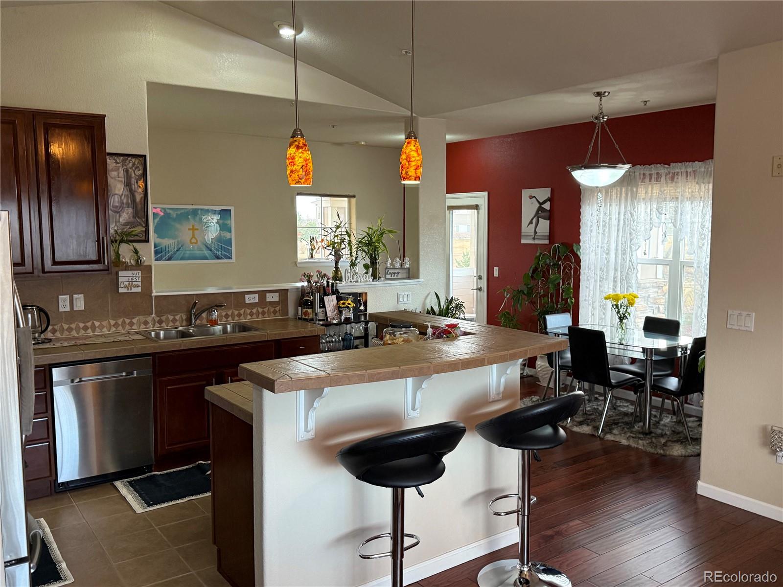 a kitchen with counter space appliances and furniture