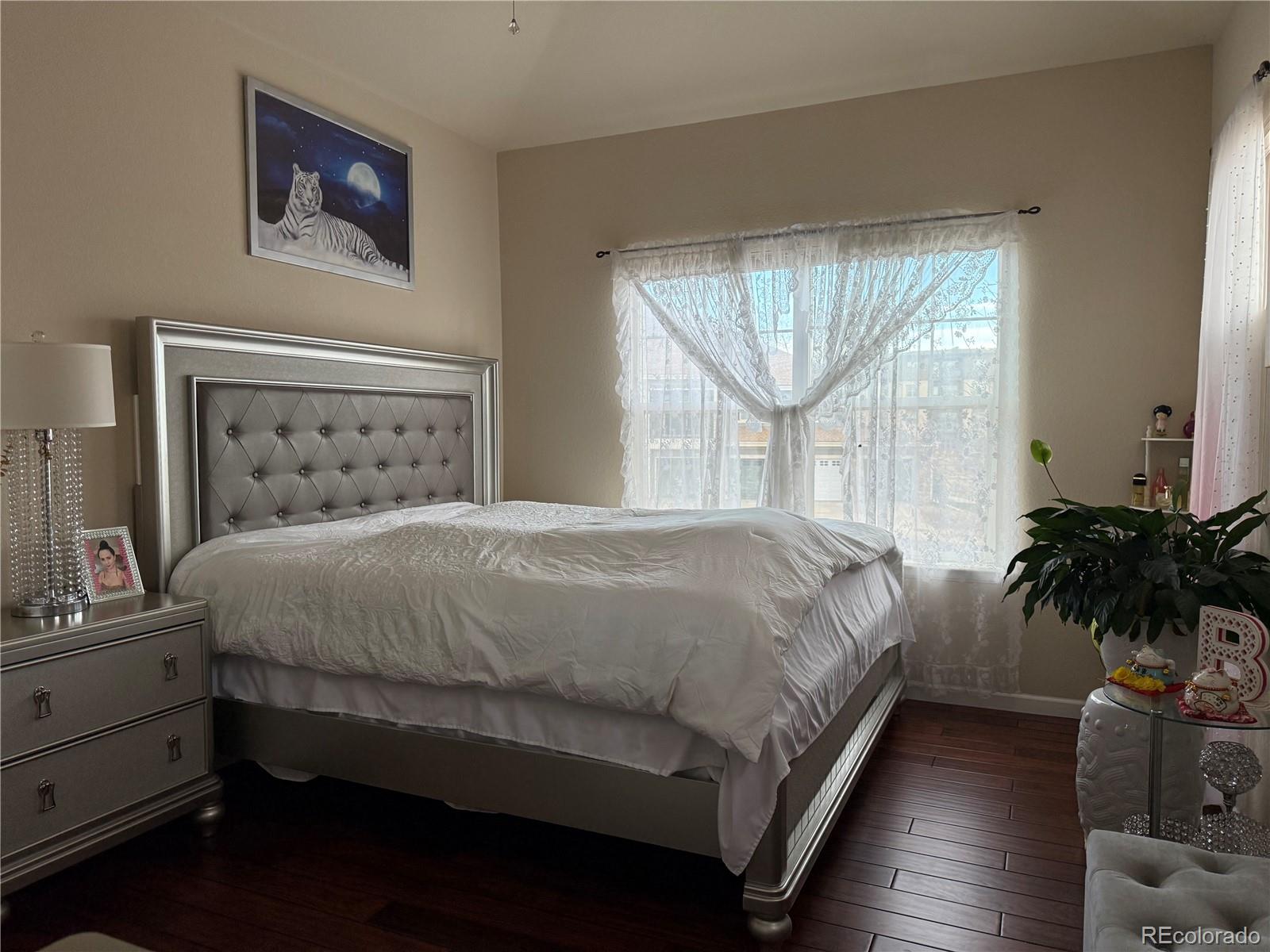 6292 Kilmer Loop, Unit 204 Golden, CO 80403 - Photo 15 of 27 a bed sitting in a bedroom next to a window