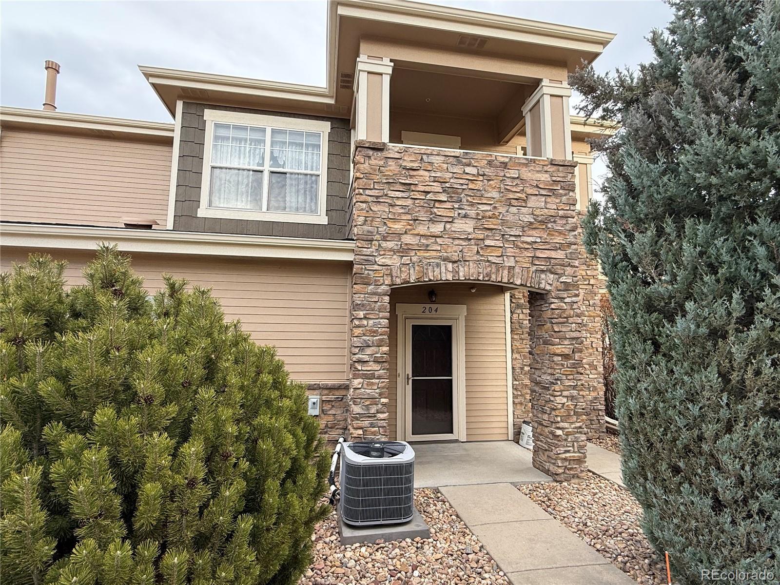 6292 Kilmer Loop, Unit 204 Golden, CO 80403 - Photo 21 of 27 a view of a house with a door and wooden floor