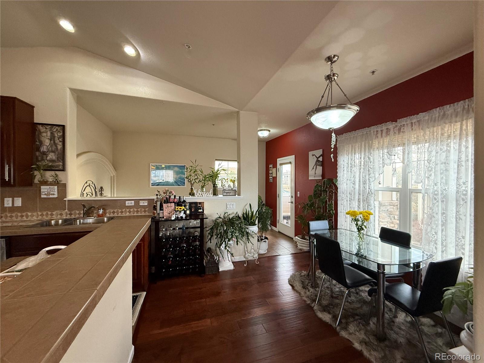 6292 Kilmer Loop, Unit 204 Golden, CO 80403 - Photo 8 of 27 a view of a dining room with furniture window and wooden floor