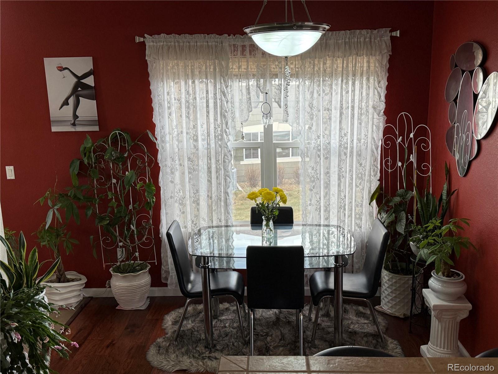 6292 Kilmer Loop, Unit 204 Golden, CO 80403 - Photo 9 of 27 a view of a dining room with furniture and chandelier