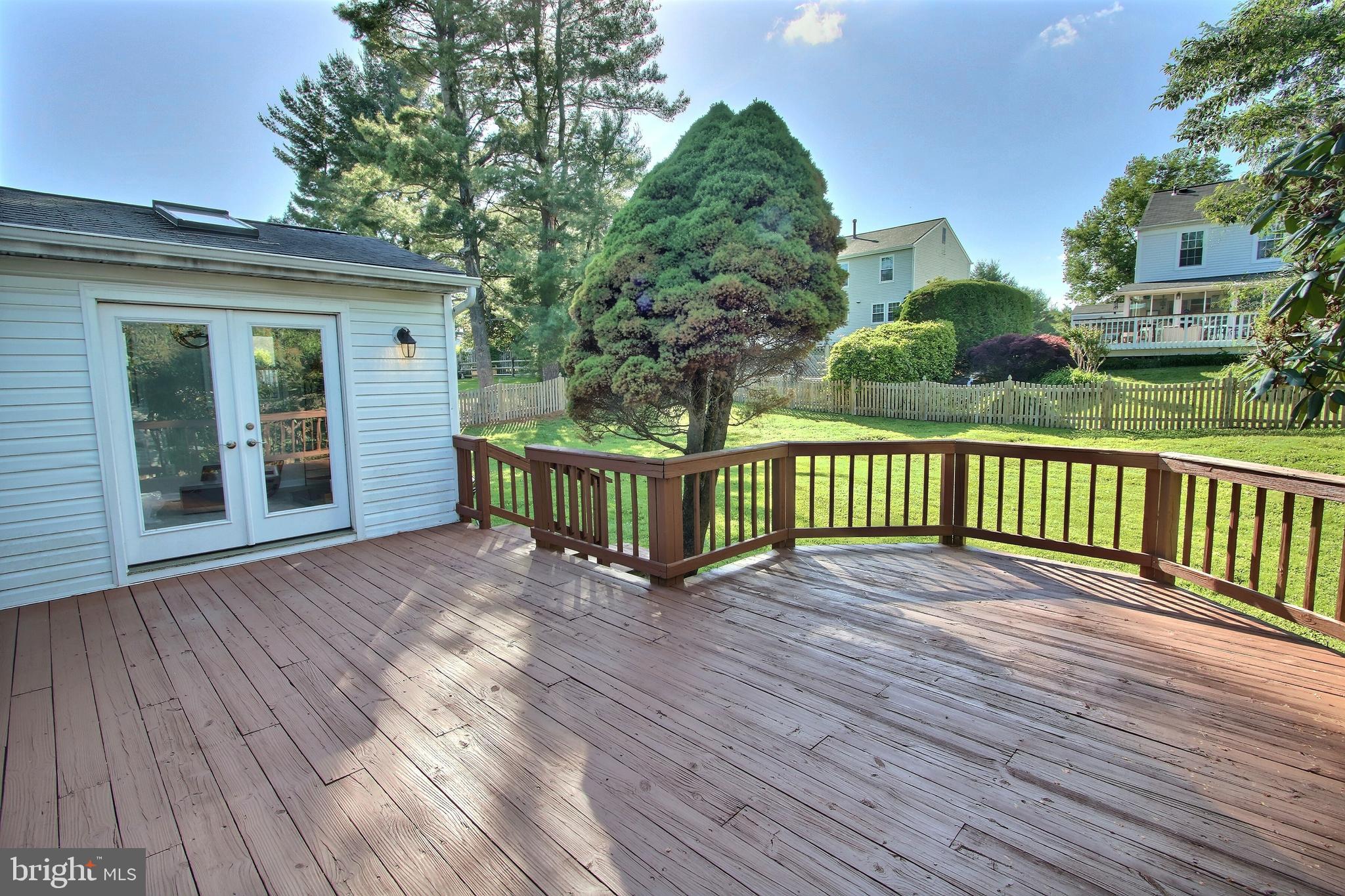 813 Pointer Ridge Drive Gaithersburg, MD 20878 - Photo 18 of 43 a view of a house with a wooden deck