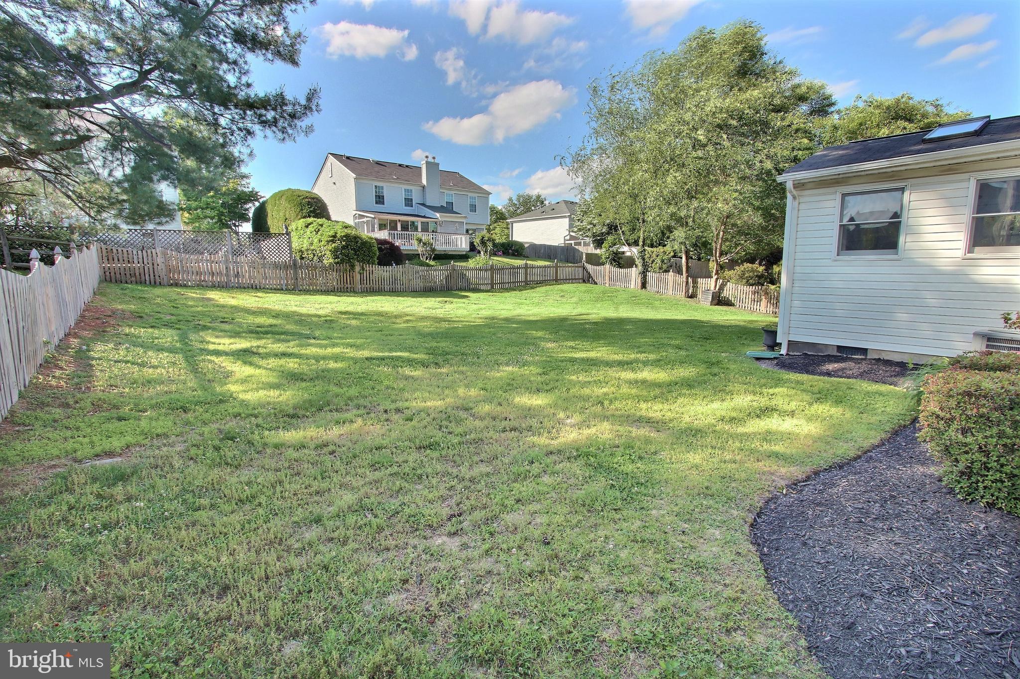 813 Pointer Ridge Drive Gaithersburg, MD 20878 - Photo 20 of 43 a view of a house with a yard