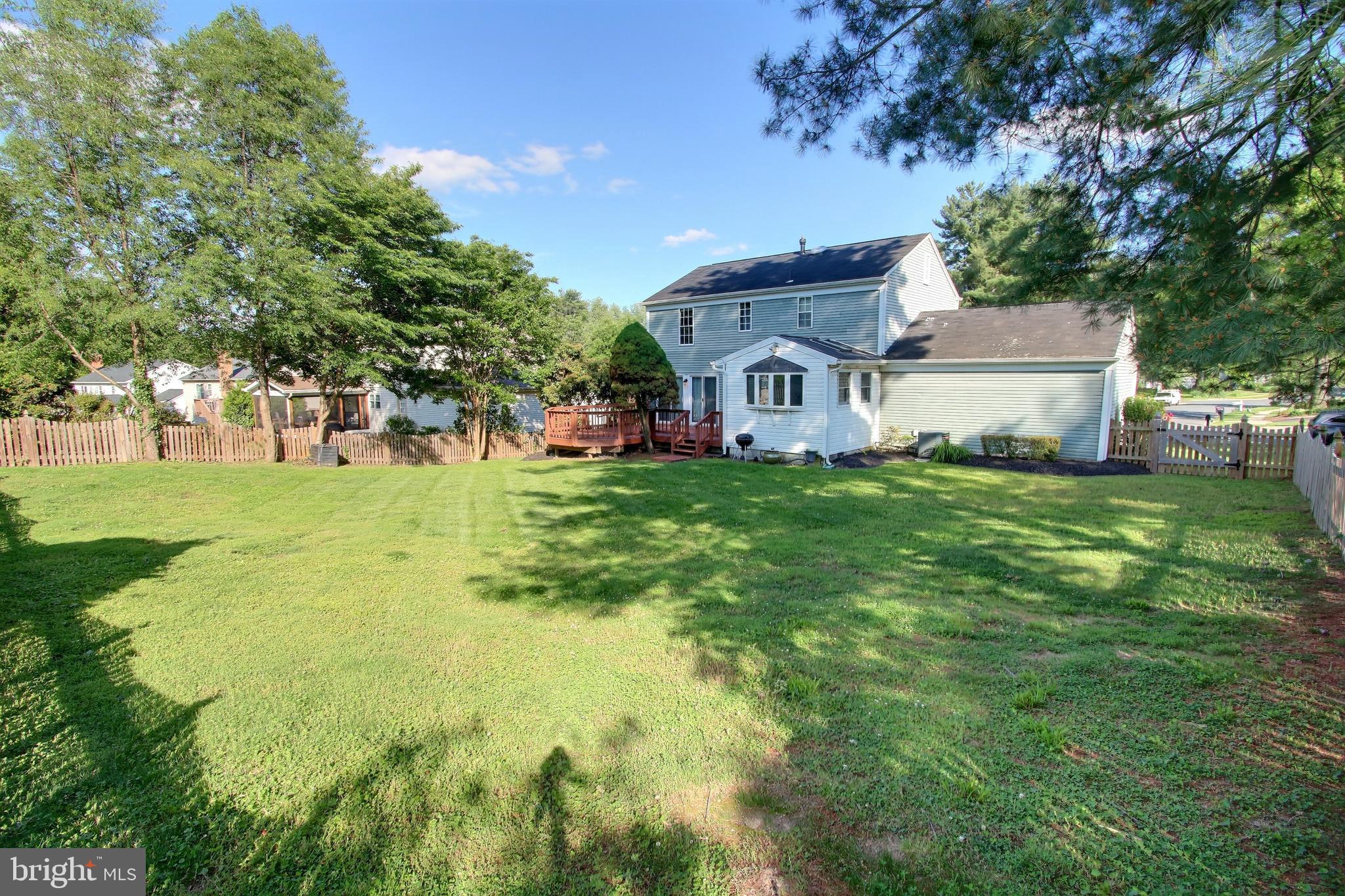 813 Pointer Ridge Drive Gaithersburg, MD 20878 - Photo 21 of 43 a view of a house with a big yard and large trees