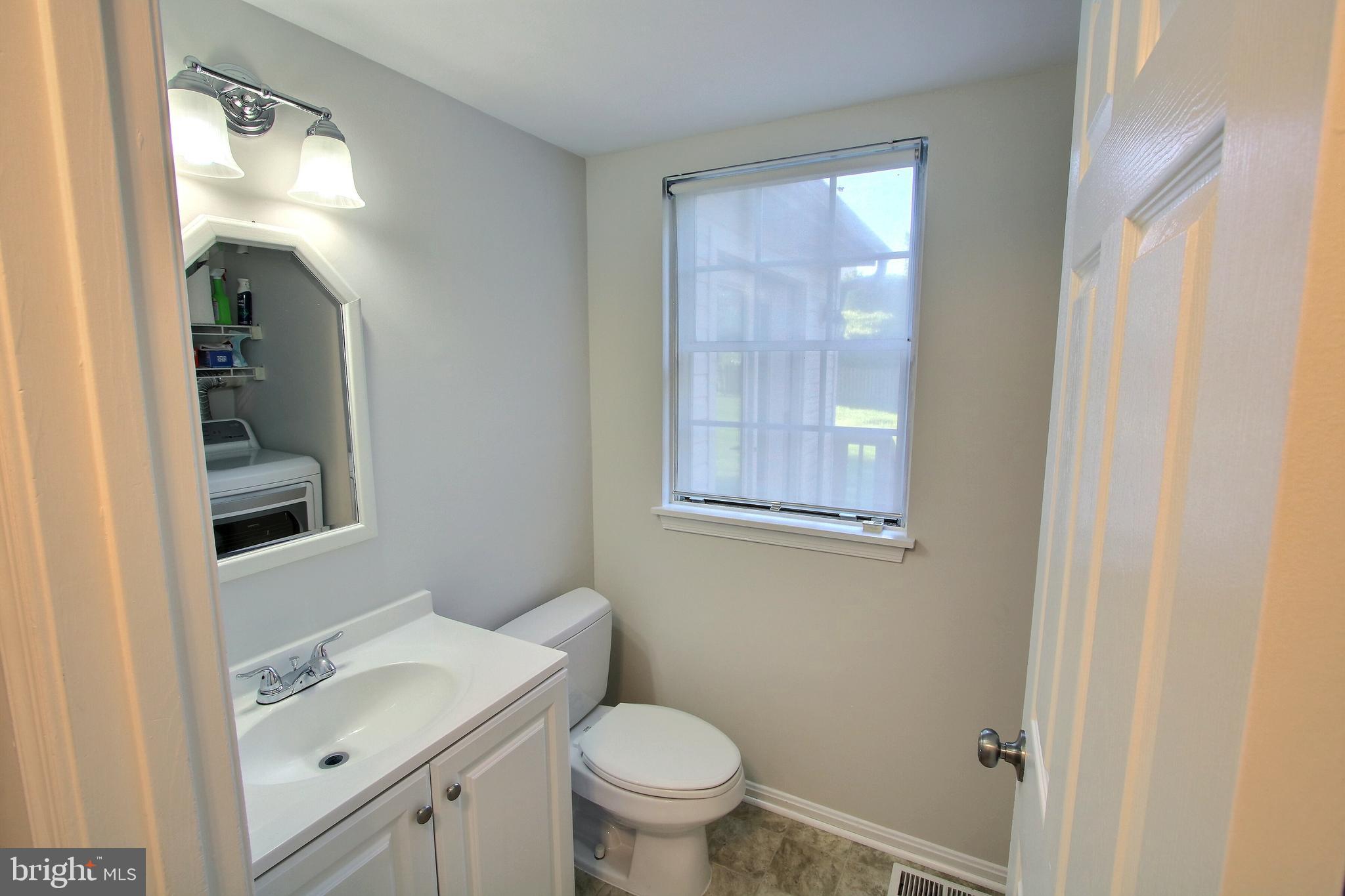 813 Pointer Ridge Drive Gaithersburg, MD 20878 - Photo 23 of 43 a bathroom with a sink toilet and shower