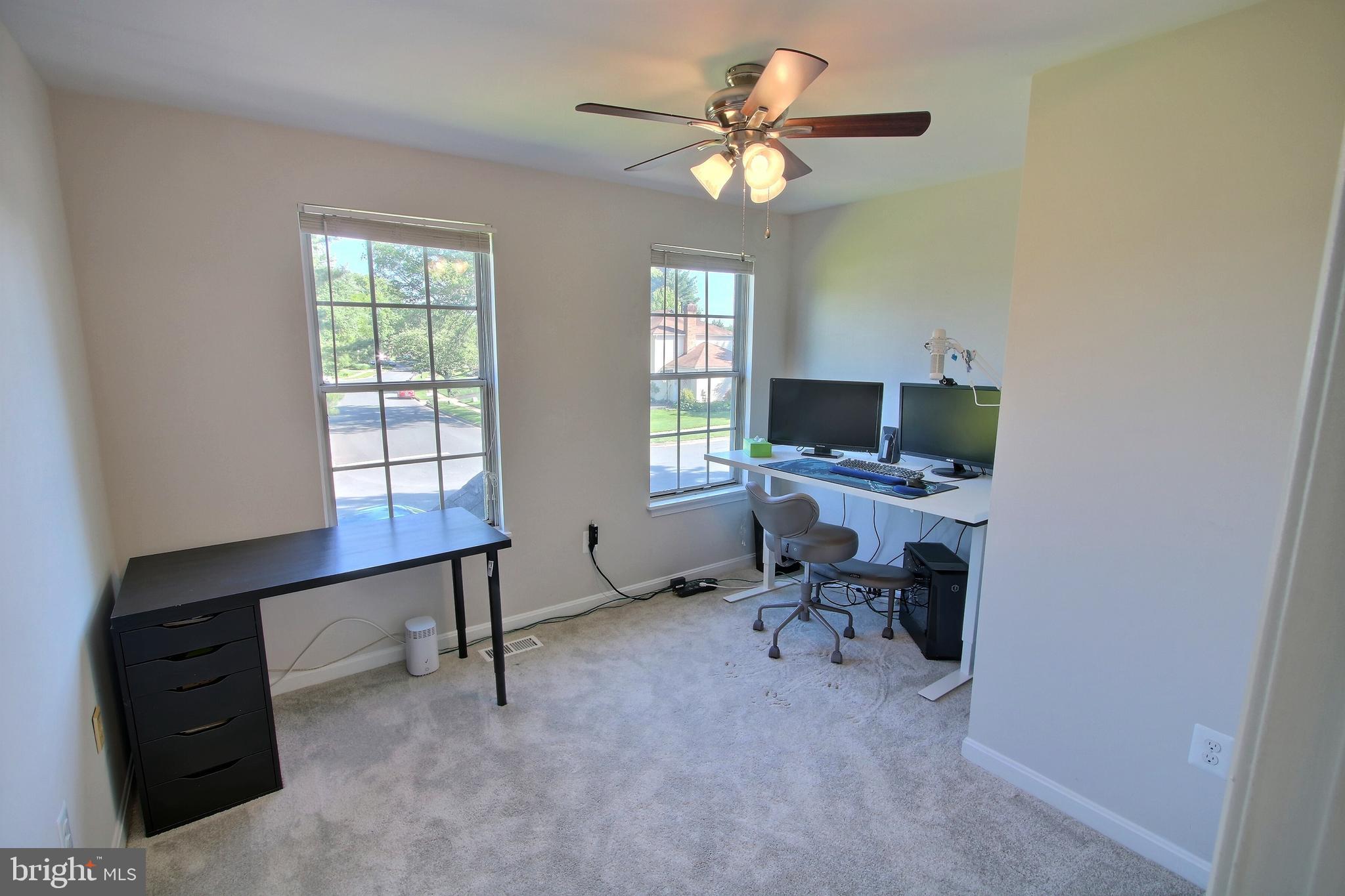 813 Pointer Ridge Drive Gaithersburg, MD 20878 - Photo 27 of 43 a view of a workspace with furniture and a window
