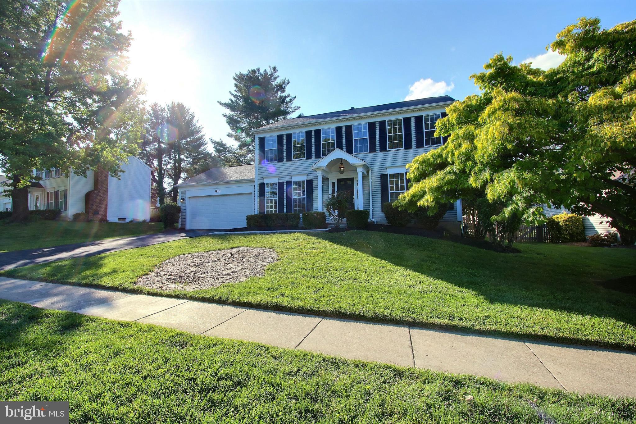 813 Pointer Ridge Drive Gaithersburg, MD 20878 - Photo 3 of 43 a front view of a house with garden