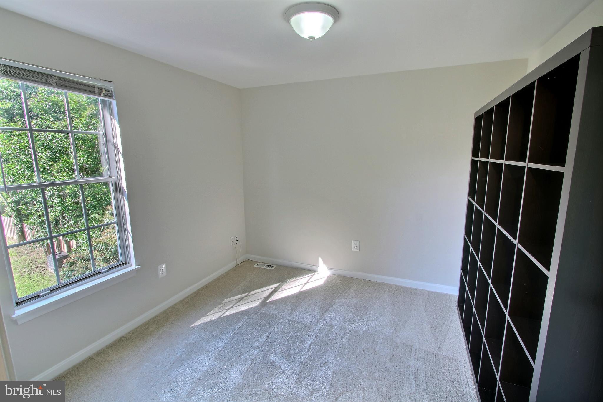 813 Pointer Ridge Drive Gaithersburg, MD 20878 - Photo 31 of 43 an empty room with windows