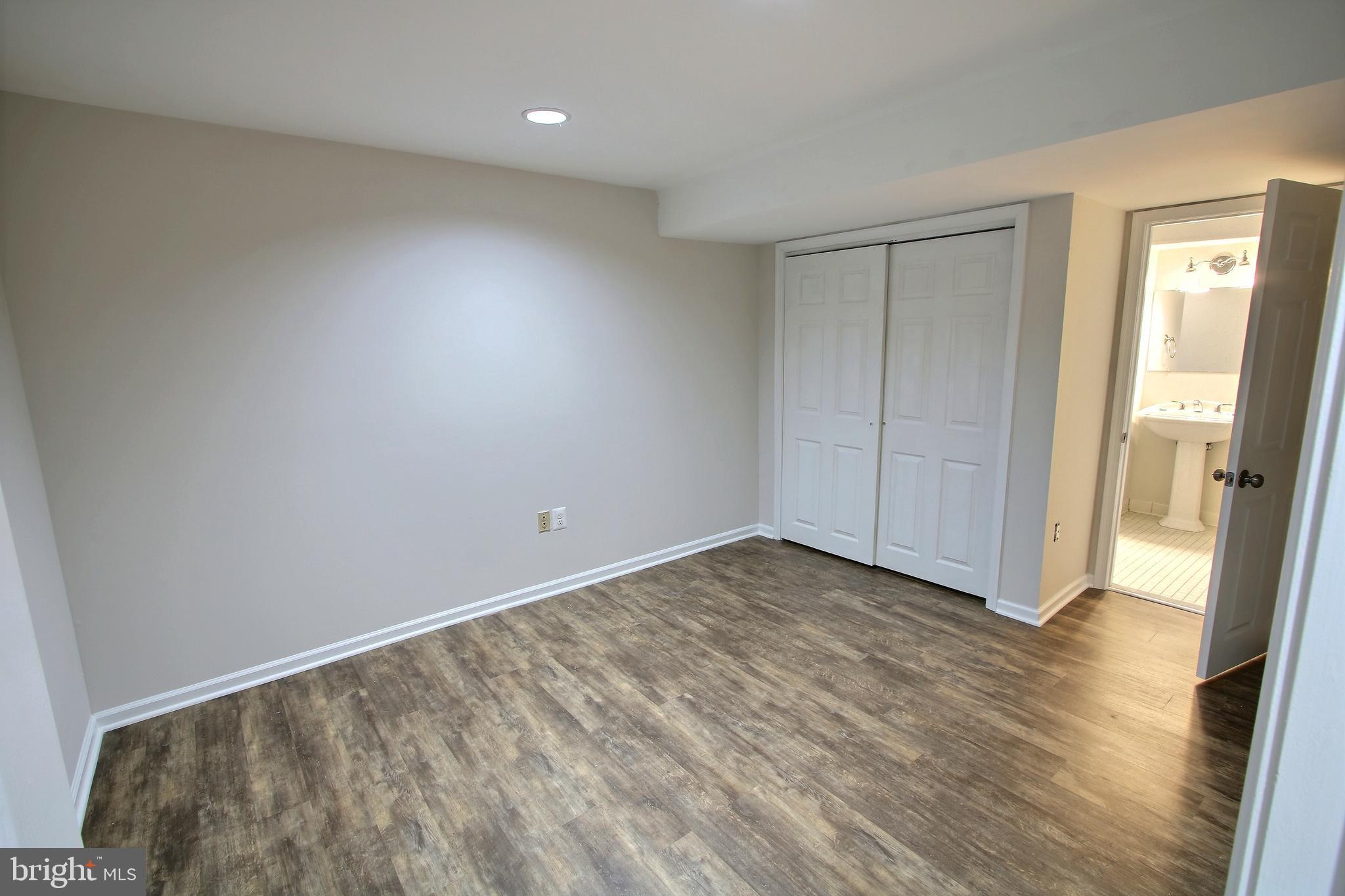 813 Pointer Ridge Drive Gaithersburg, MD 20878 - Photo 37 of 43 a view of an empty room and wooden floor