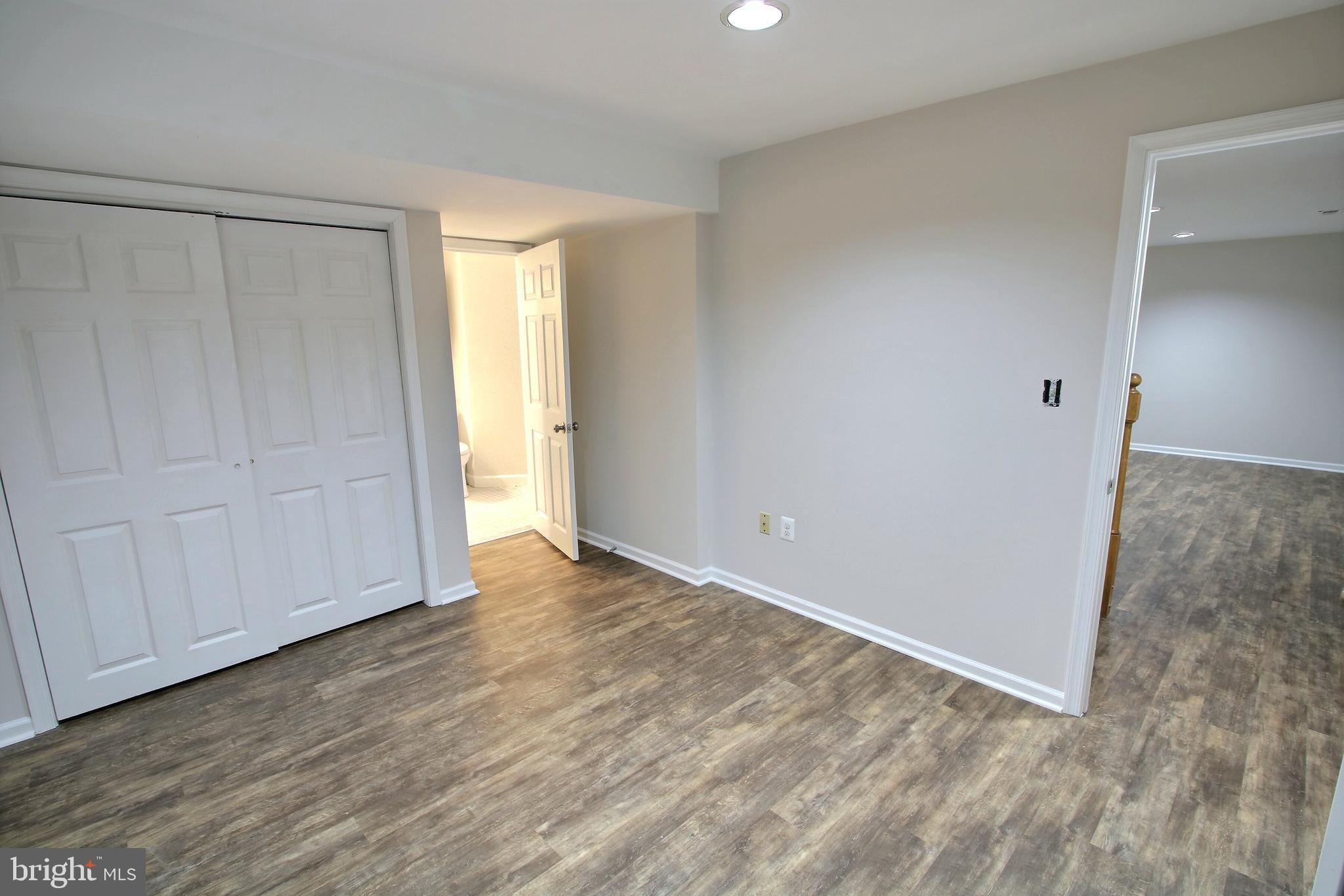 813 Pointer Ridge Drive Gaithersburg, MD 20878 - Photo 38 of 43 a view of an empty room and wooden floor