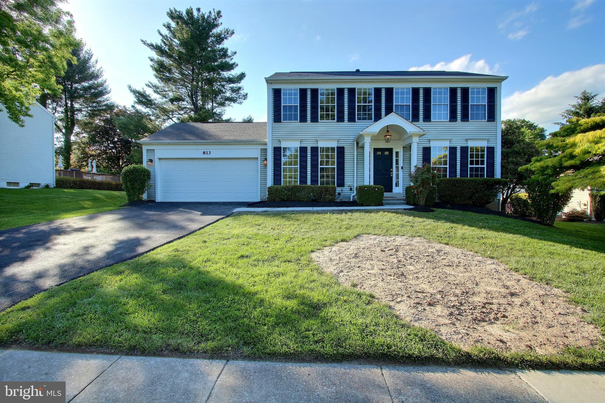 813 Pointer Ridge Drive Gaithersburg, MD 20878 - Photo 41 of 43 a front view of a house with a yard