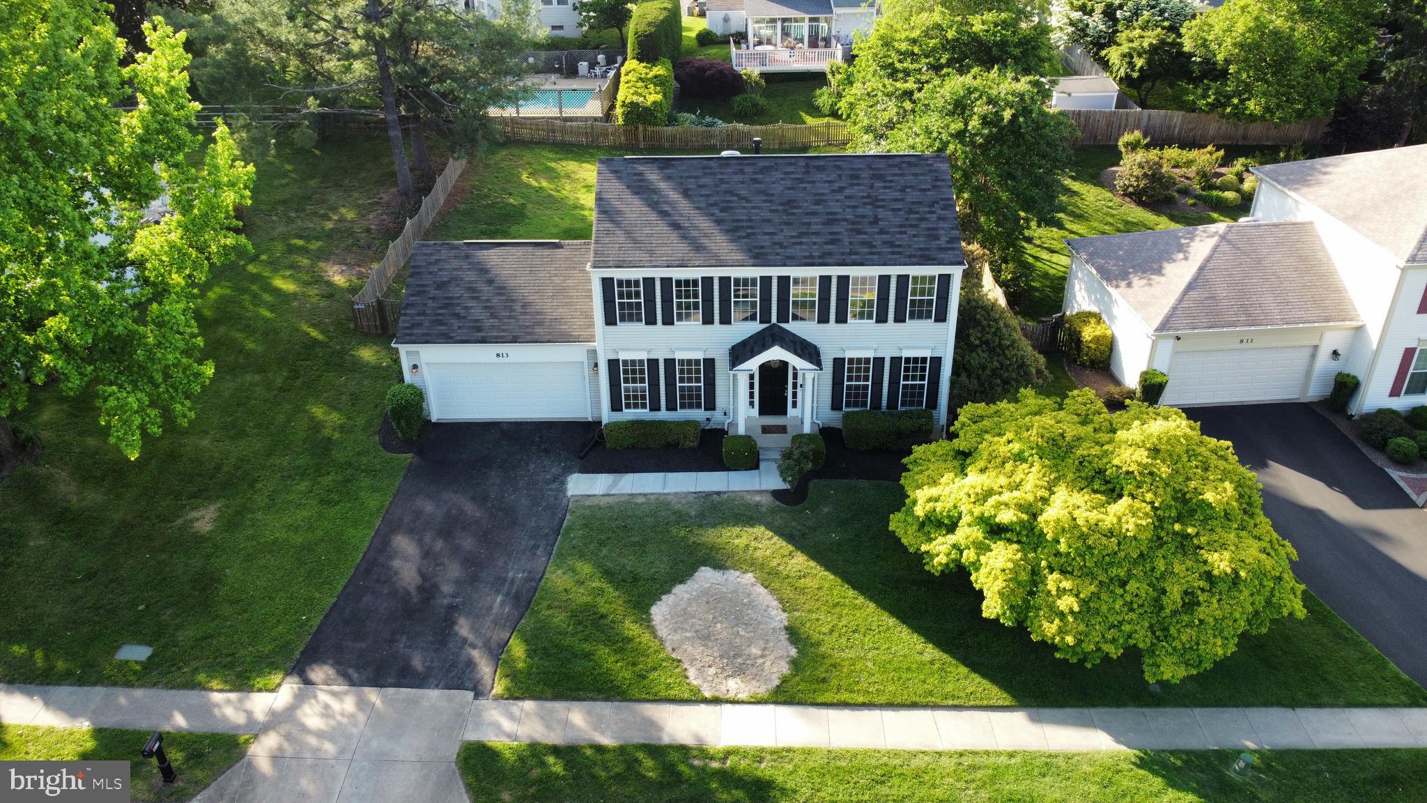 813 Pointer Ridge Drive Gaithersburg, MD 20878 - Photo 42 of 43 a front view of a house with garden