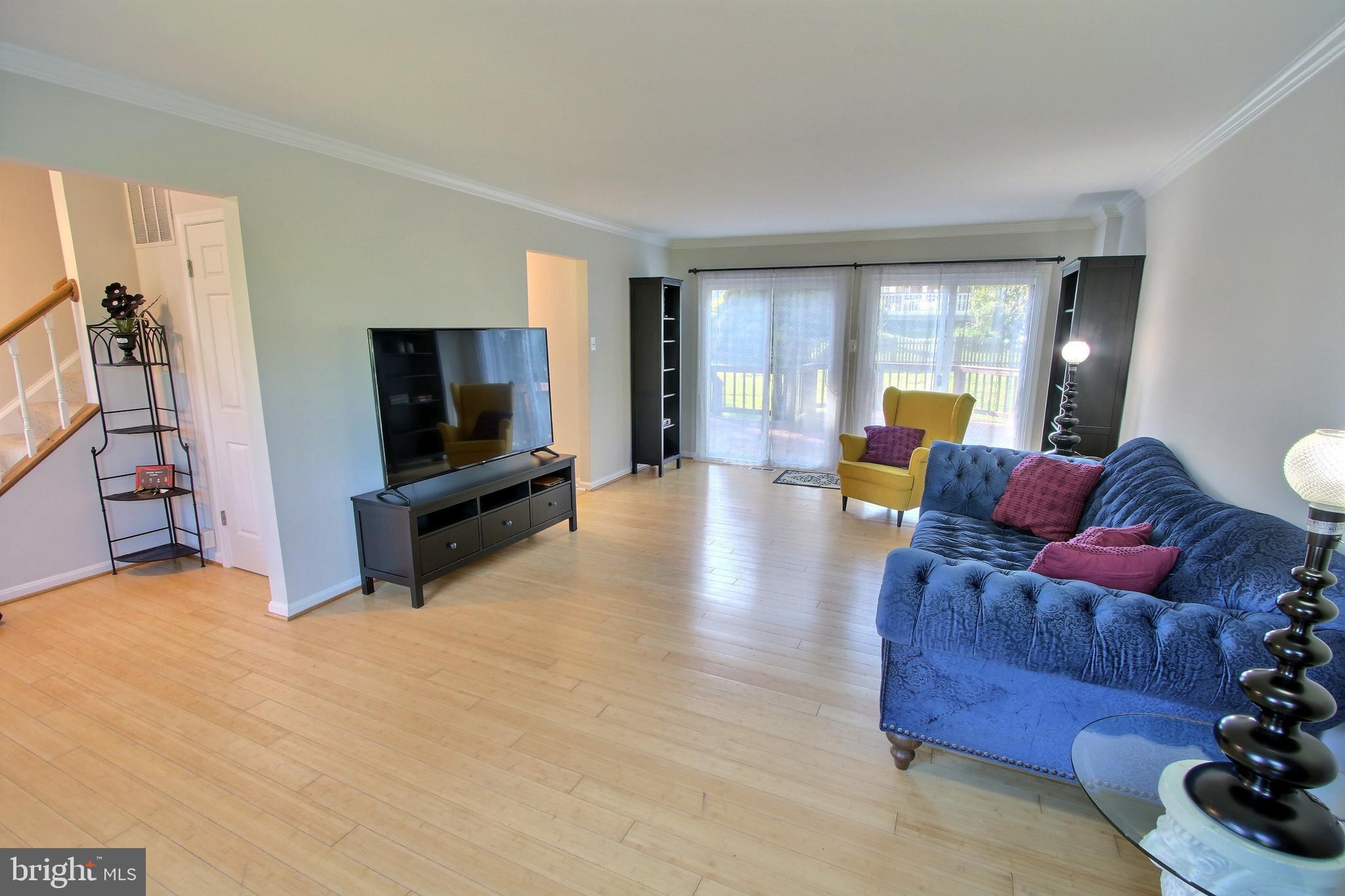 813 Pointer Ridge Drive Gaithersburg, MD 20878 - Photo 7 of 43 a living room with furniture and a flat screen tv