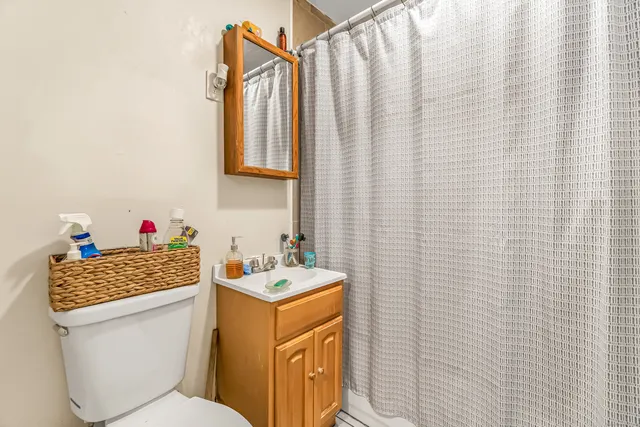 a bathroom with a toilet and a sink