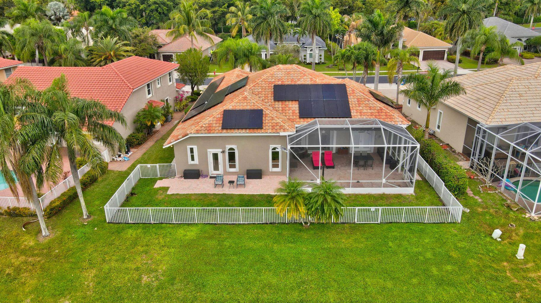 12364 Clearfalls Drive Boca Raton, FL 33428 - Photo 16 of 32 a view of a house with a yard