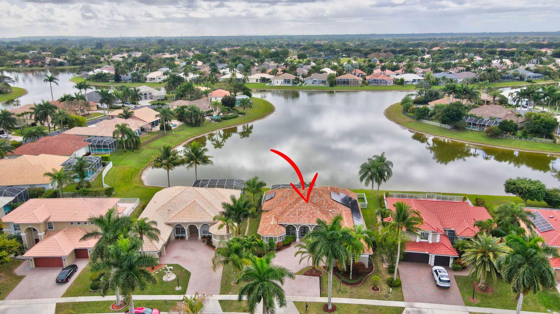 12364 Clearfalls Drive Boca Raton, FL 33428 - Photo 2 of 32 an aerial view of residential houses with outdoor space and lake view