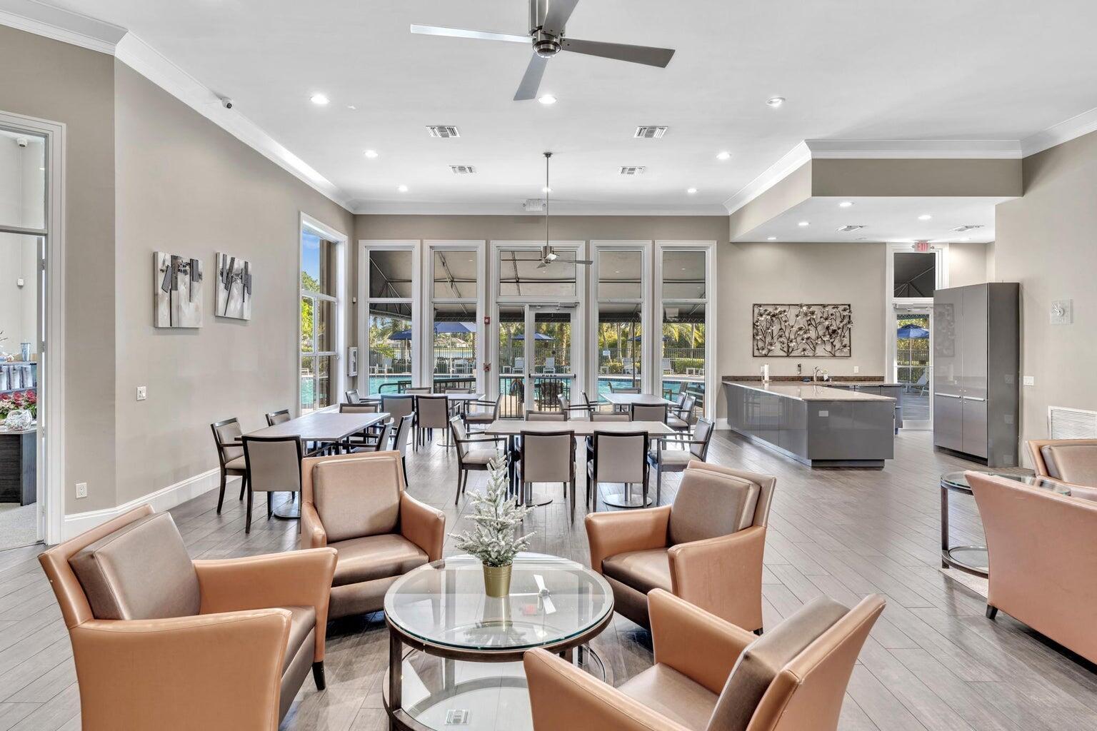 12364 Clearfalls Drive Boca Raton, FL 33428 - Photo 22 of 32 a dining room with furniture large window and wooden floor