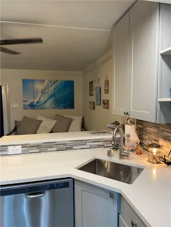 a view with a sink and a mirror