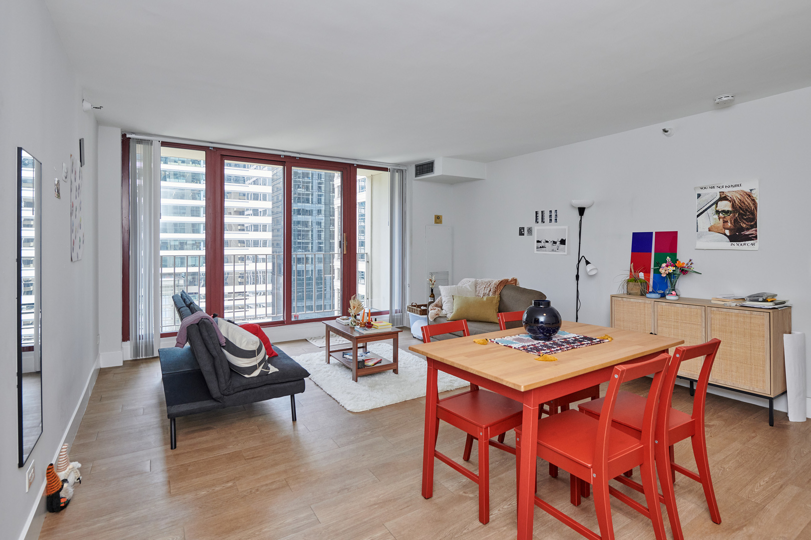 200 North Dearborn Street, Unit 1808 Chicago, IL 60601 - Photo 18 of 32 a view of a dining room with furniture and a potted plant