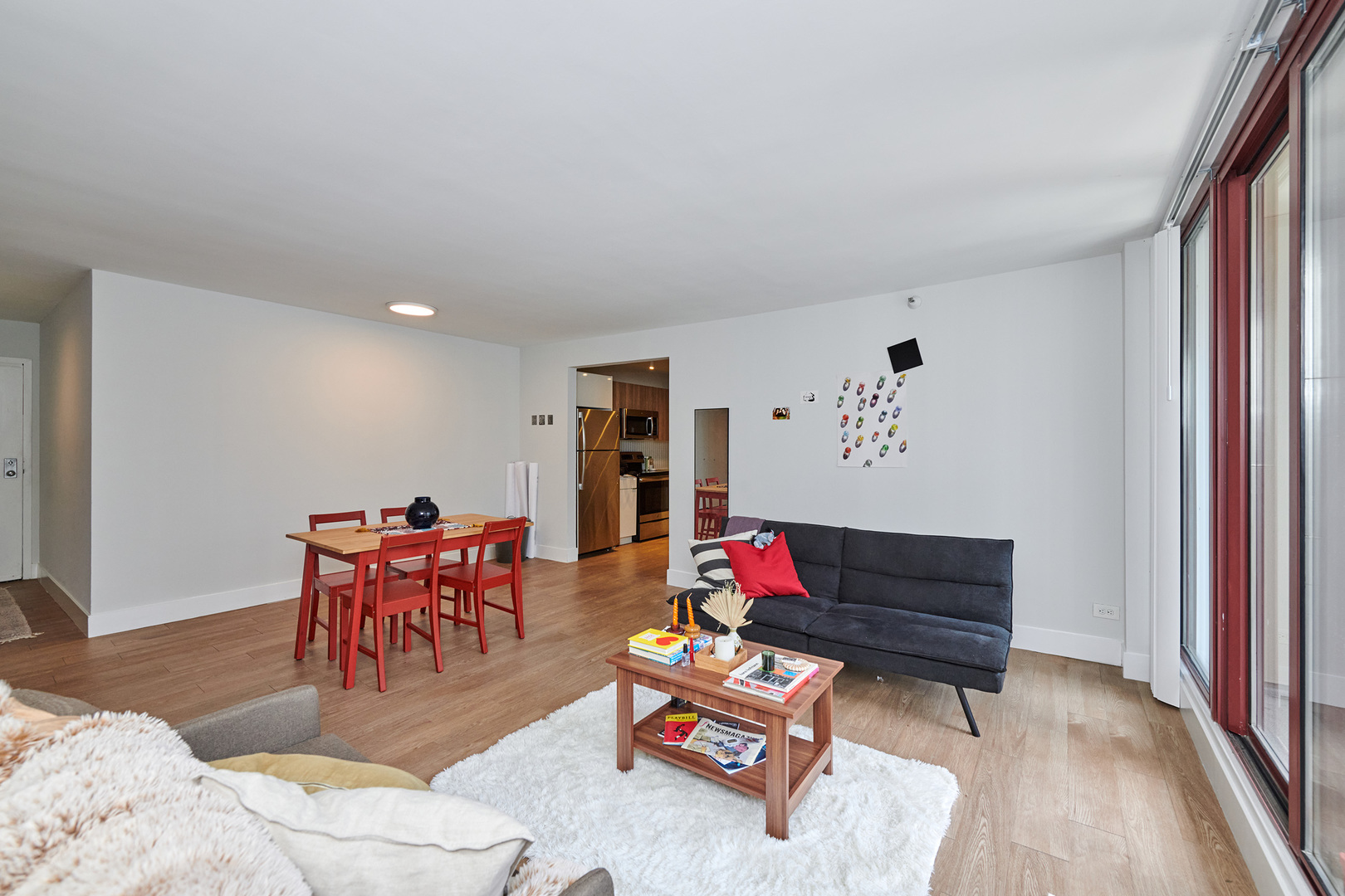 200 North Dearborn Street, Unit 1808 Chicago, IL 60601 - Photo 3 of 32 a living room with furniture and wooden floor