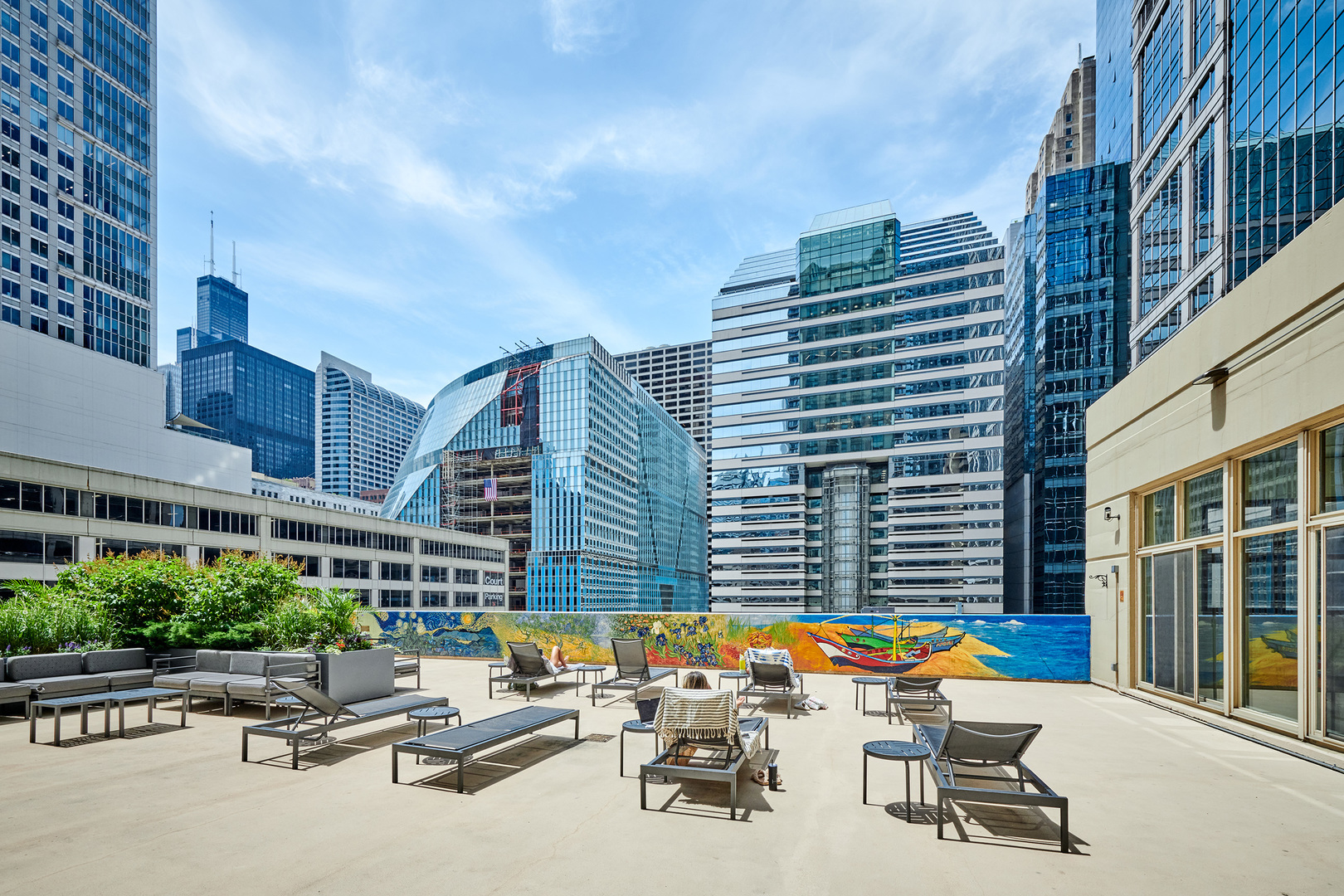 200 North Dearborn Street, Unit 1808 Chicago, IL 60601 - Photo 31 of 32 a view of a patio with a table and chairs and potted plants