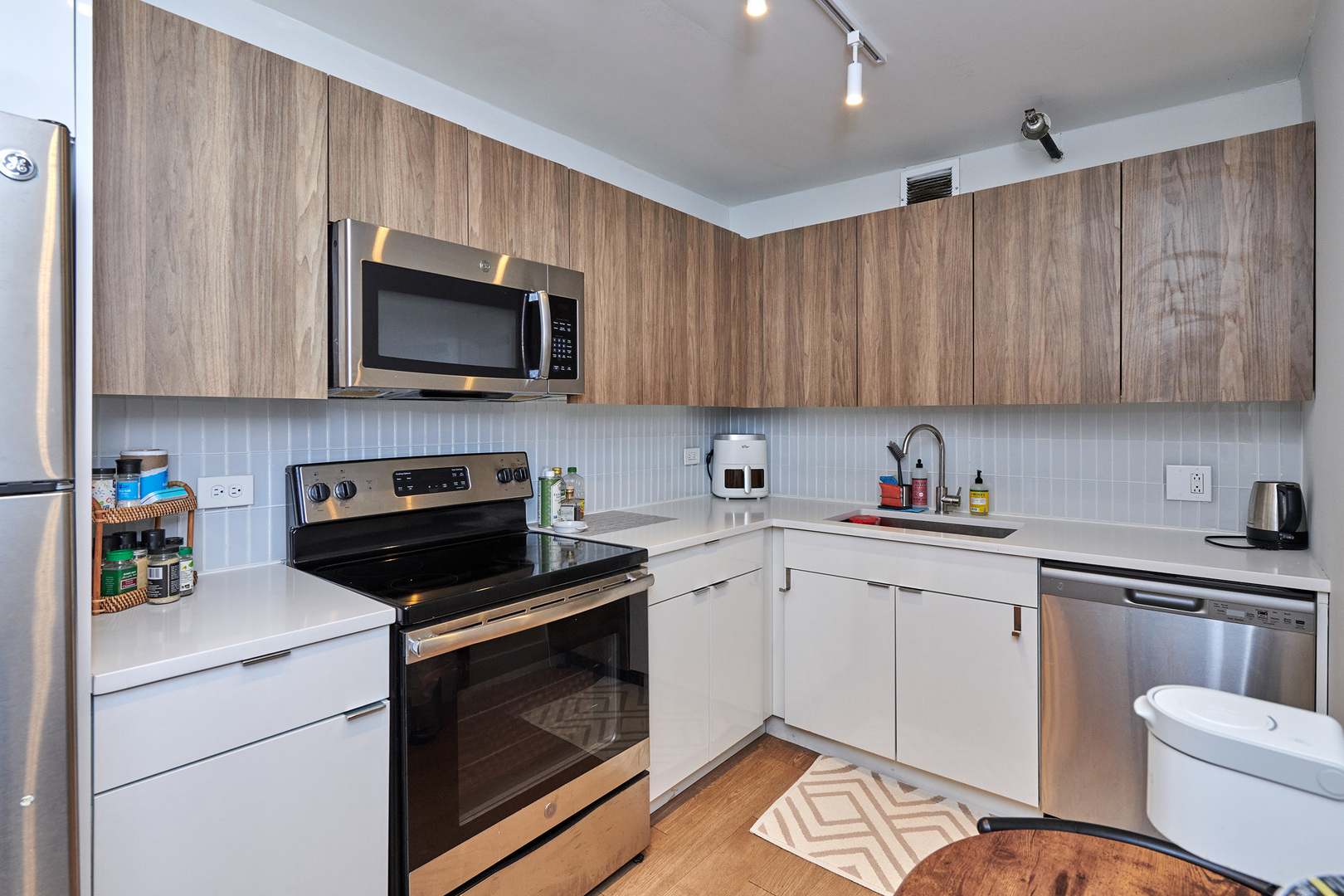 200 North Dearborn Street, Unit 1808 Chicago, IL 60601 - Photo 6 of 32 a kitchen with a sink cabinets and appliances