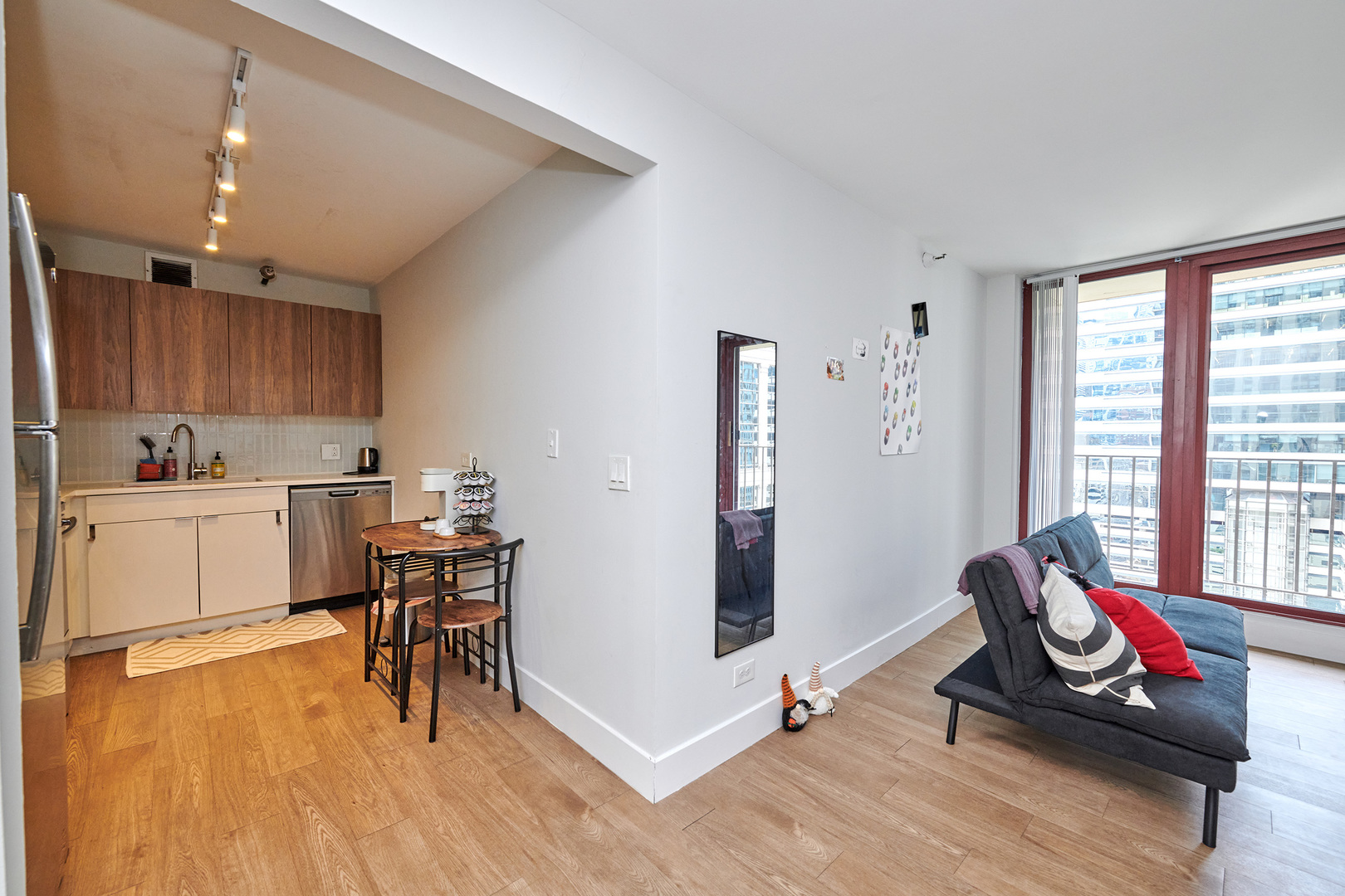200 North Dearborn Street, Unit 1808 Chicago, IL 60601 - Photo 7 of 32 a workspace with furniture and a wooden floor
