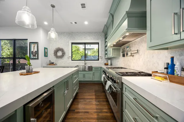 a kitchen with a stove and a sink