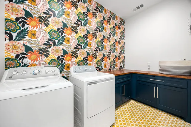 a bathroom with a sink vanity granite tub and shower