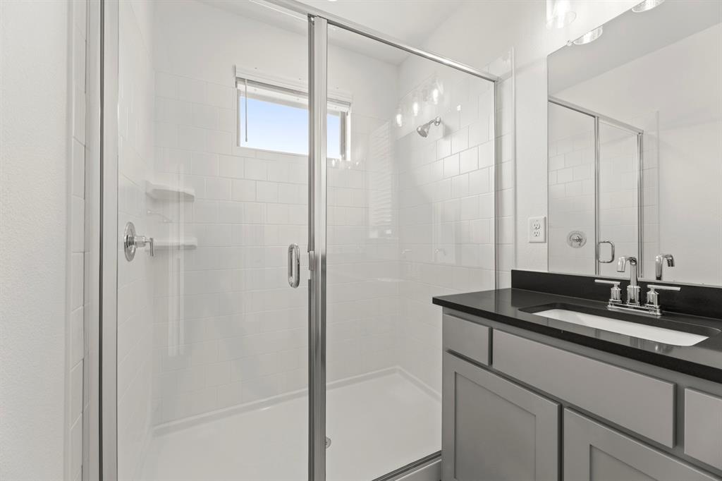 2543 Brunswick Way Allen, TX 75013 - Photo 28 of 34 a bathroom with a granite countertop sink shower and a mirror