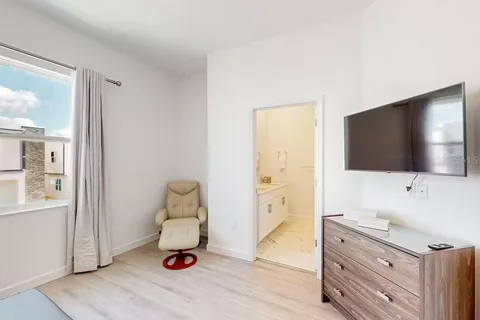 a living room with furniture and flat screen tv