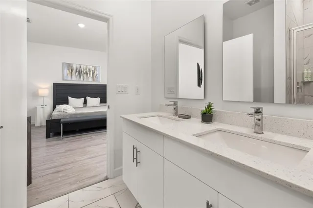 a large white bed in a white room