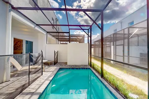 a view of swimming pool with seating area