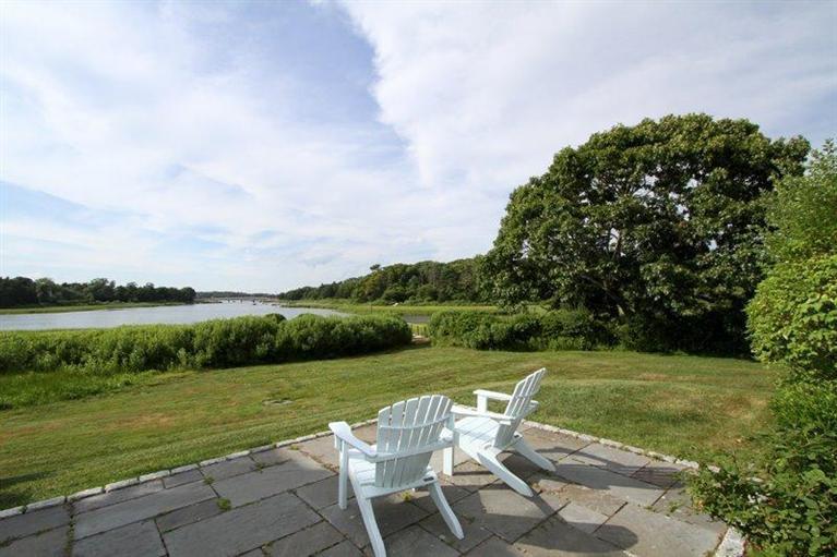 128 Little Neck Bars Road Falmouth, MA 02540 - Photo 1 of 35 a view of a lake with a big yard